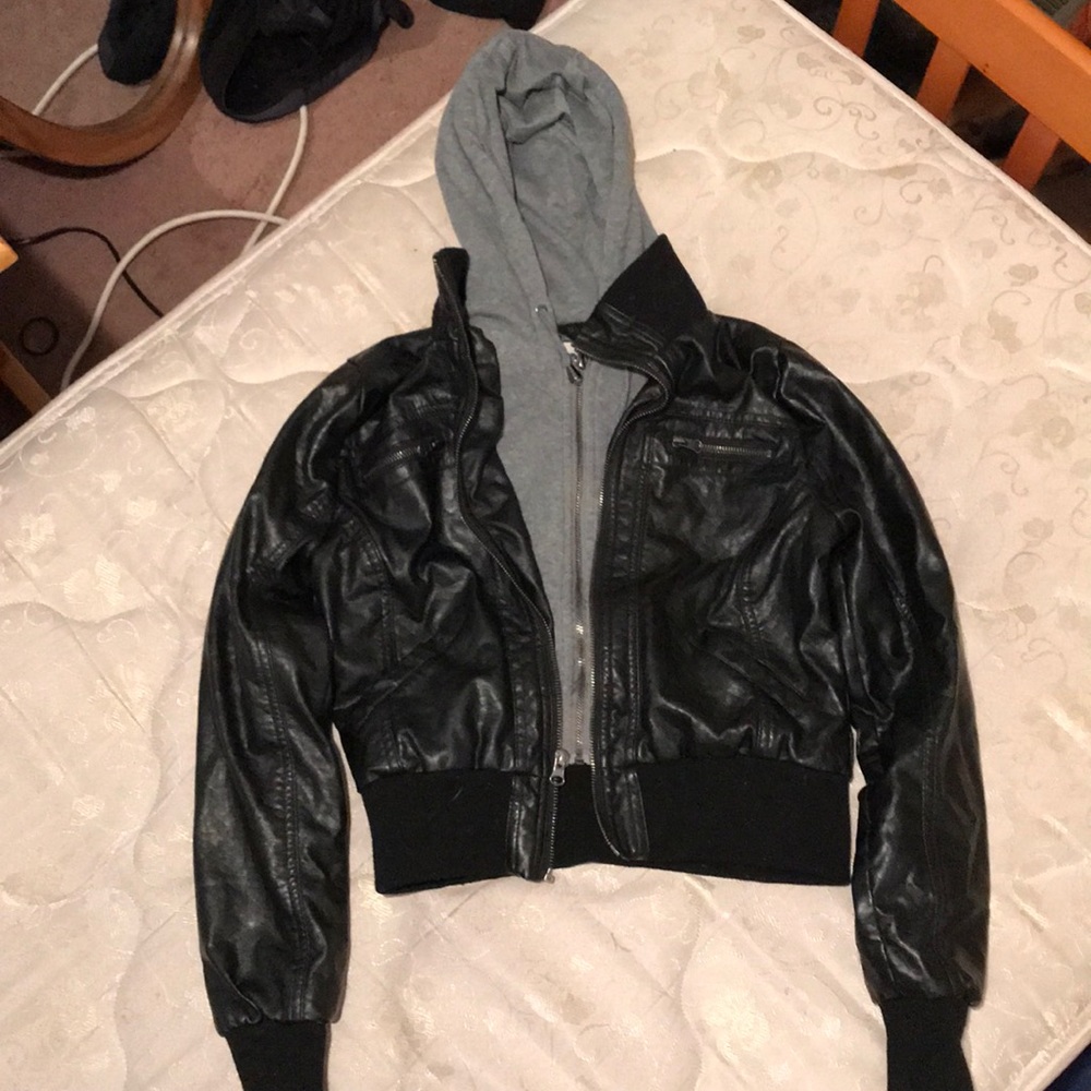 Leather jacket with sweater hoodie.